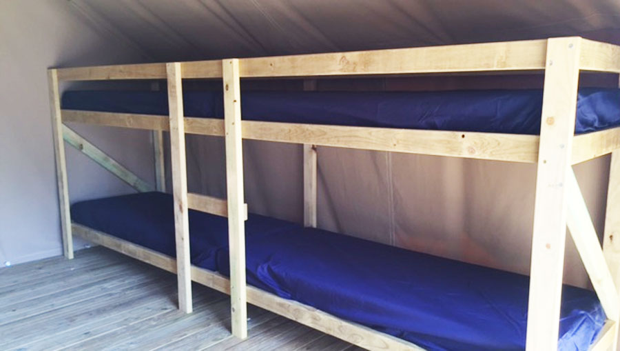 Bunks inside tent accommodation