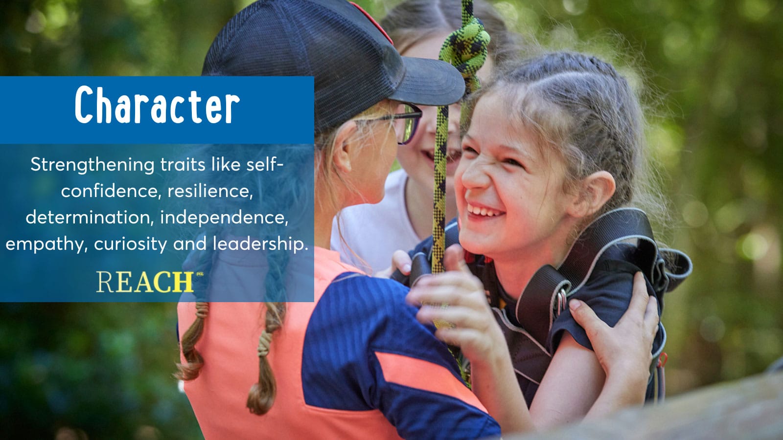 A young girl embracing a smiling friend on a playground, under a banner about R.E.A.C.H. character traits such as confidence and resilience.