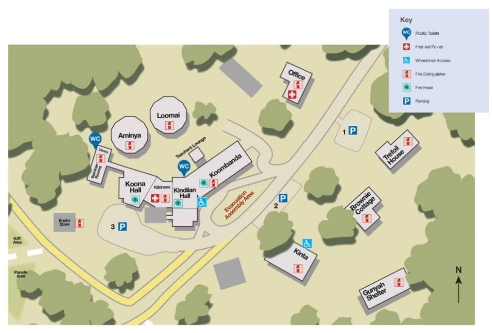 Map of a facility showing buildings, parking areas, toilets, wheelchair access, first aid points, fire extinguishers, fire hoses, and key locations with a legend in the top right corner.